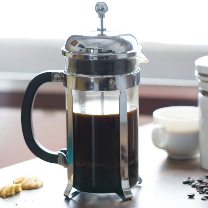 photo of french press or cafetiere being used to brew specialty coffee
